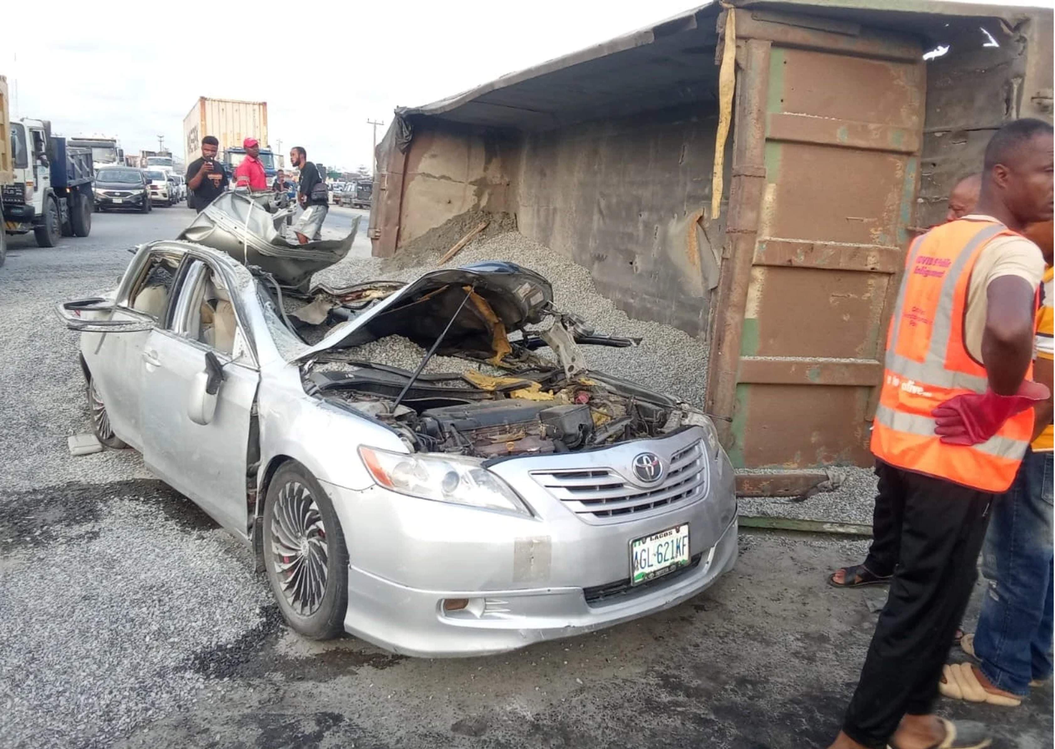 Man Killed, Wife Hurt as Truck Crushes Car in Lagos